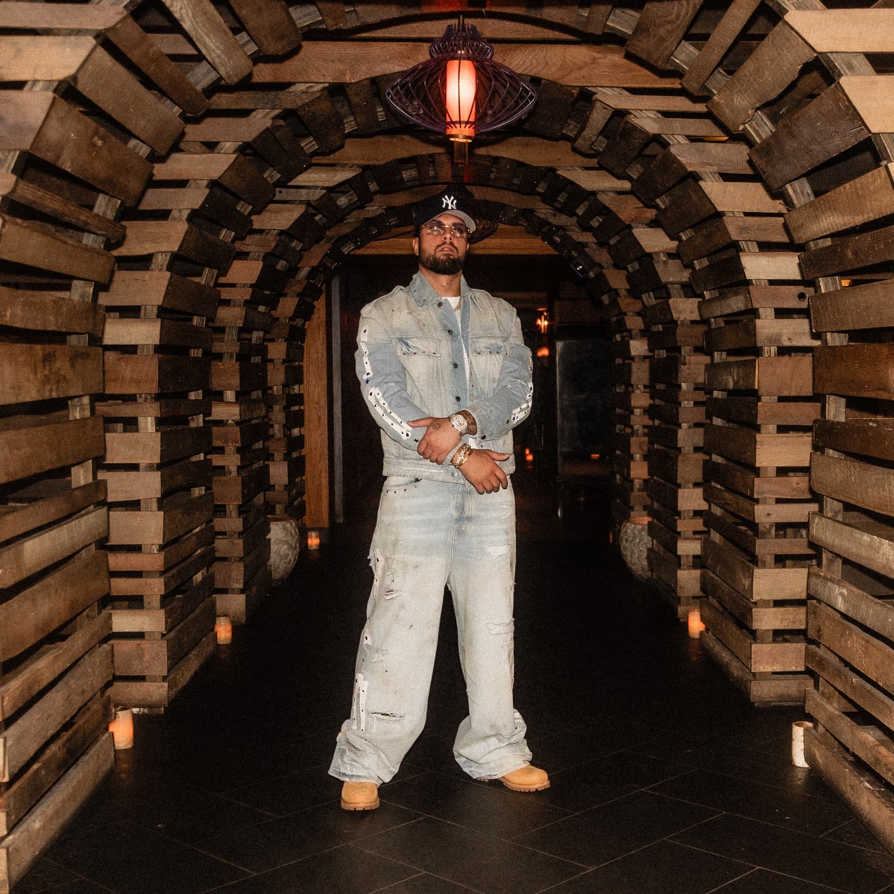 David Chaboki (Shibo / GodsBurnt) standing in the wooden Bodega Negra tunnel at TAO Downtown during DDNYC 2026 in New York