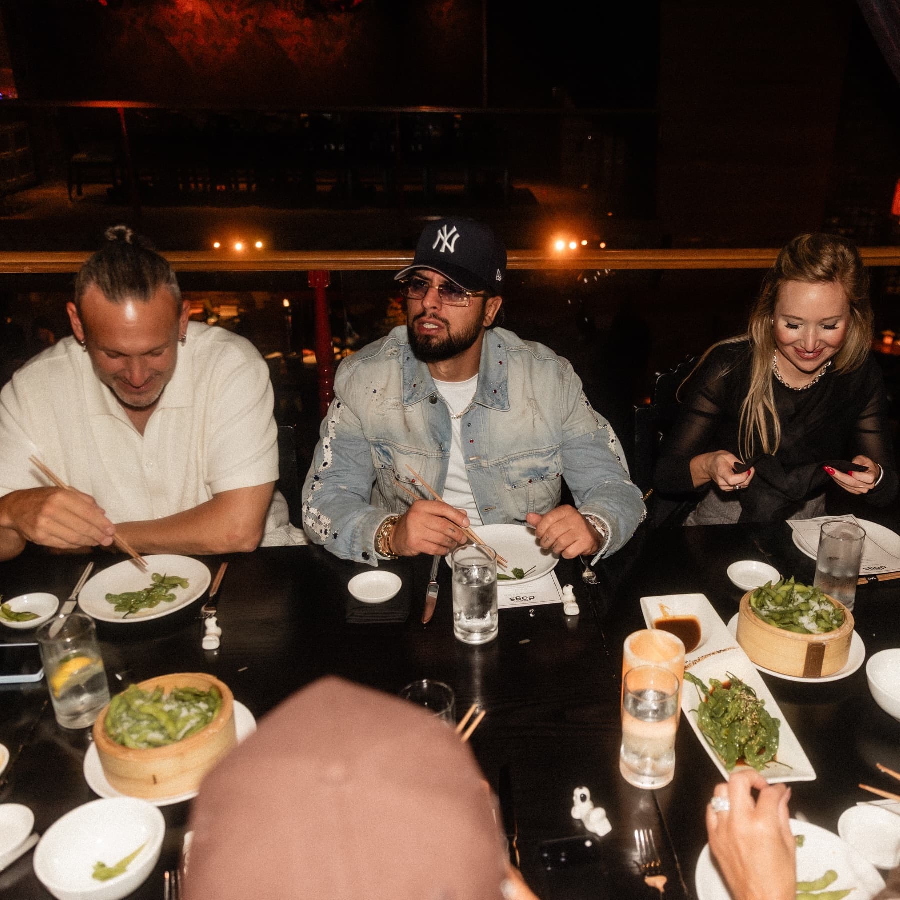 David Chaboki (Shibo / GodsBurnt) at a DDNYC 2026 rooftop dinner table in New York City