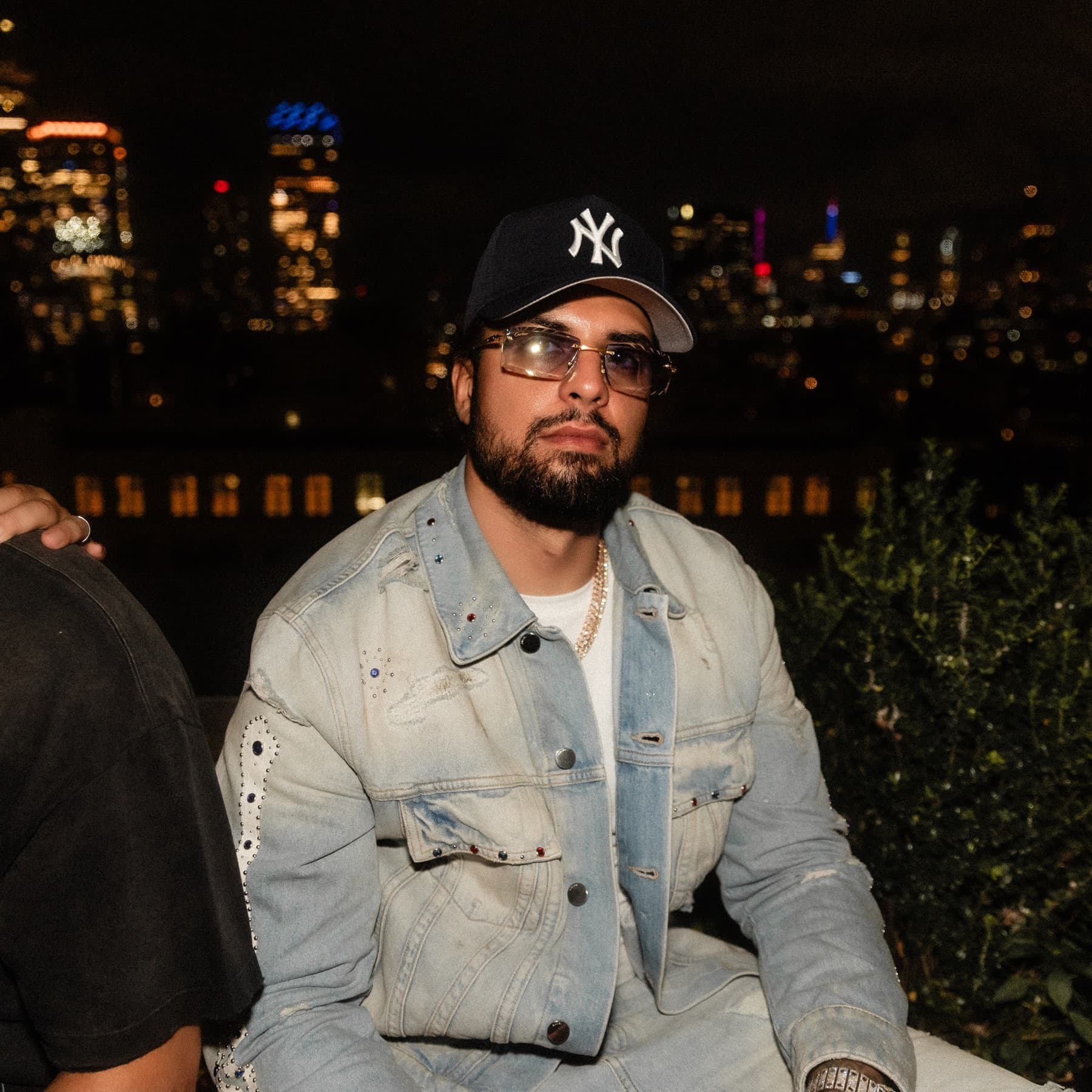David Chaboki (Shibo / GodsBurnt) on a DDNYC 2026 rooftop with the New York City skyline behind him
